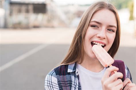 woman eating popsicle